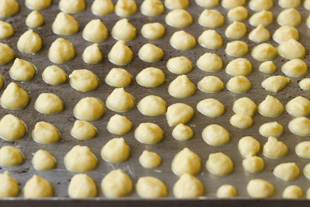 A tray of freshly made Moong Dal Mangodi drying in the sun, spread evenly