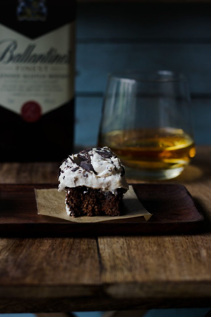 Sliced Eggless Whiskey Coffee Poke Cake showing rich, moist layers