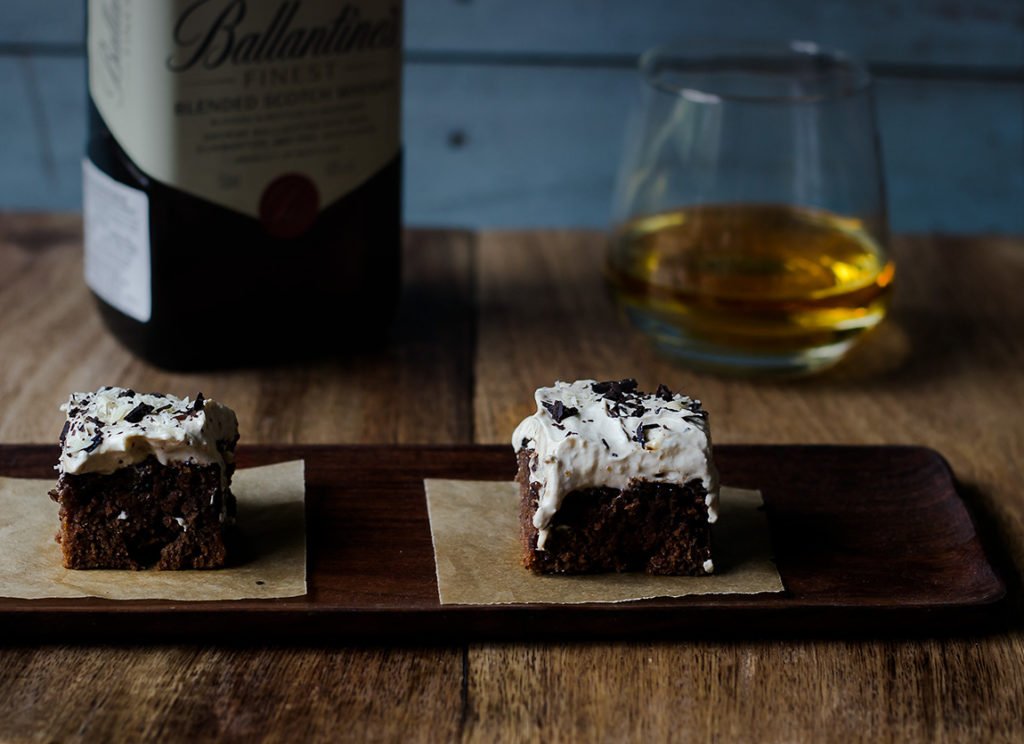 Two slices of Whiskey Coffee Poke Cake, served to enjoy