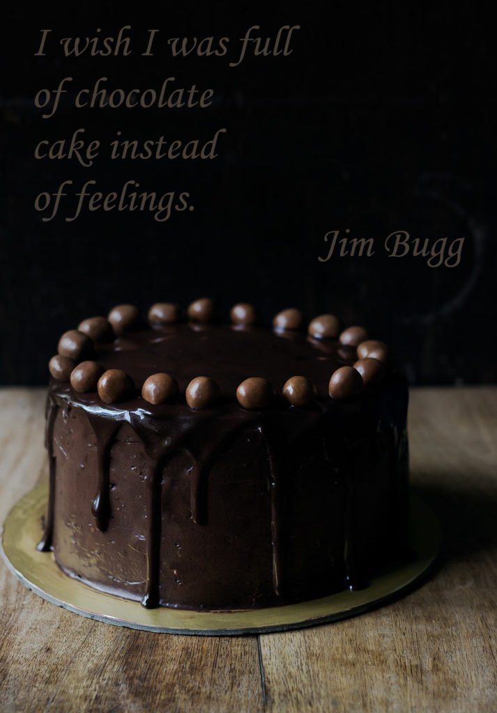 Chocolate frosting over the top layer of the Old Fashioned Chocolate Cake