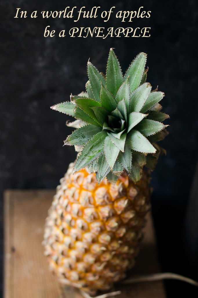 A whole riped pineapple placed on a table