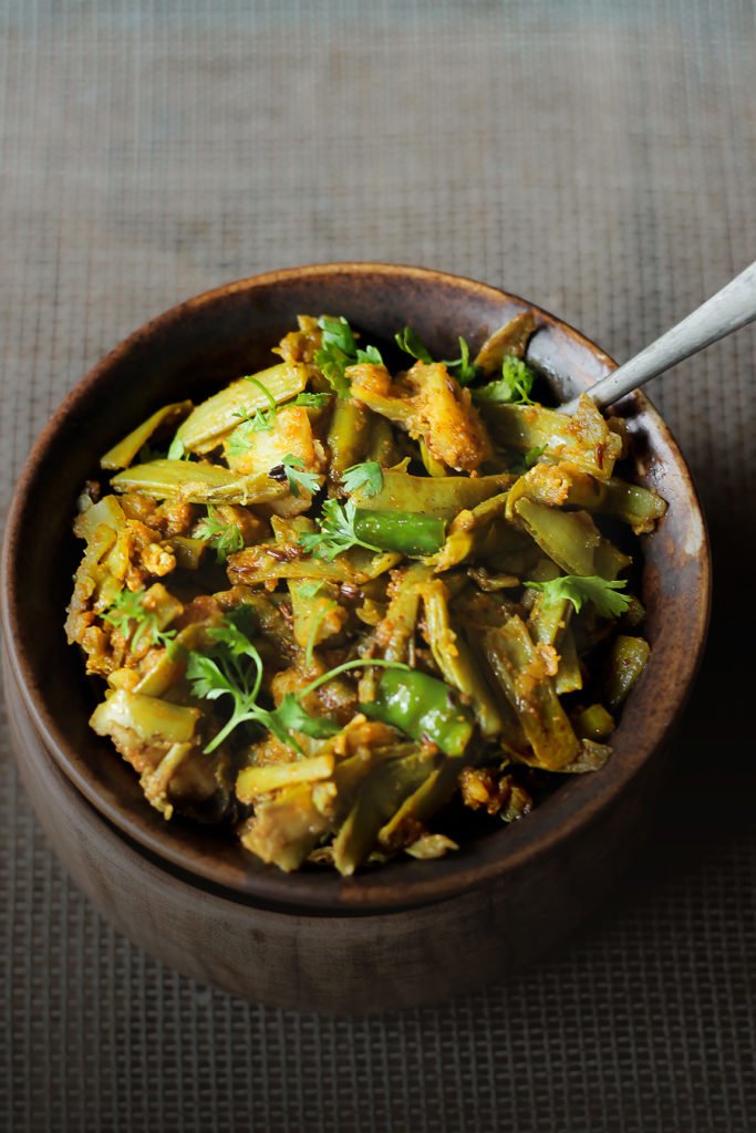 An overhead view of Gawar Phali Ki Sabji in a pan, just after cooking