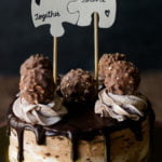 A beautifully decorated Eggless Ferrero Rocher Cake topped with whipped cream