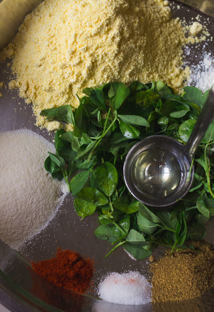 Ingredients for Makka Methi Bhakri: maize flour, fresh methi leaves and spices