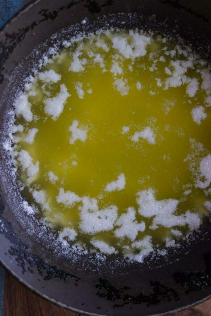 Bubbles forming as the butter melts and simmers in the pan