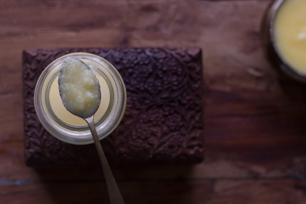 A spoonful of ghee showcasing its texture