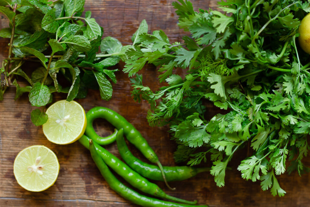 Fresh coriander leaves, mint leaves, chillies and lemon to make mint coriander chutney
