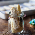 Freshly baked Eggless Lady Fingers in a jar