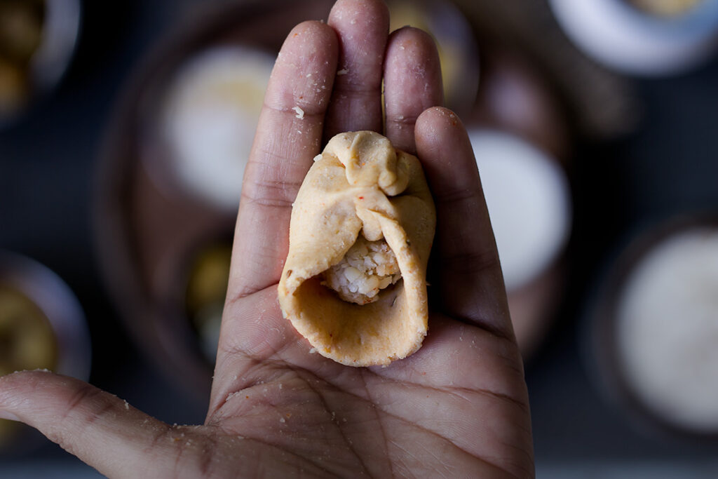 Bedmi Puri dough being kneaded with spices and lentils