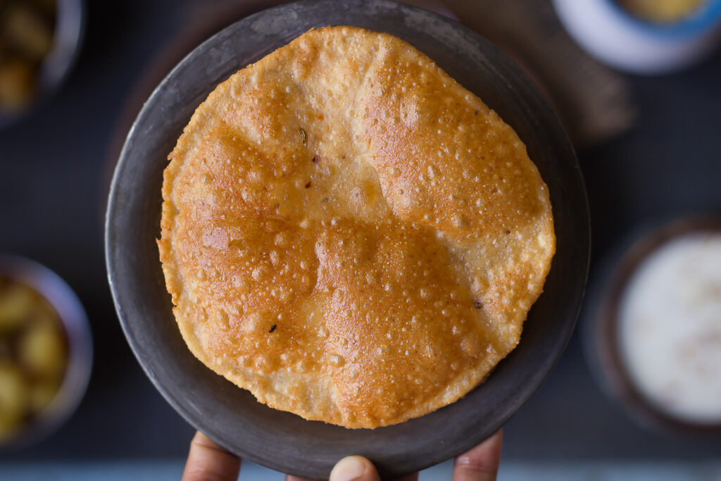 Bedmi Puris came out fried from hot oil, puffing up to golden perfection