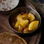 The final dish of Aloo Tamatar Ki Sabji served in a bowl