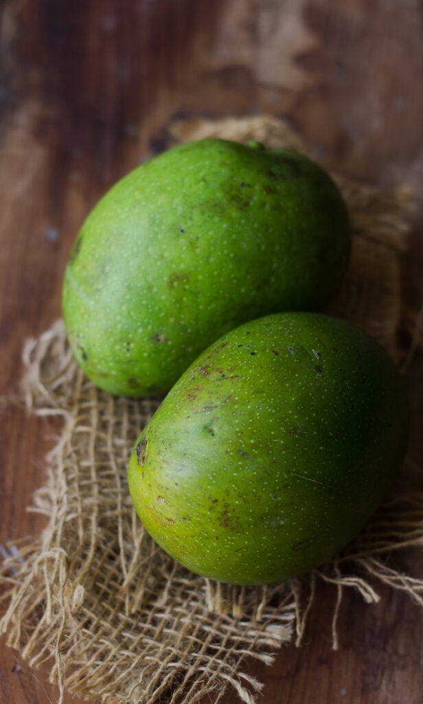 Two raw mangoes ready to make mango pickle