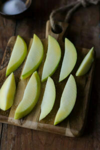 Raw mangoes cut into small pieces for pickling