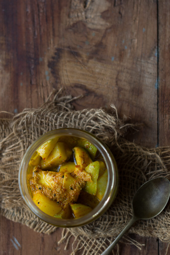 A jar of homemade mango pickle ready to enjoy as a side dish