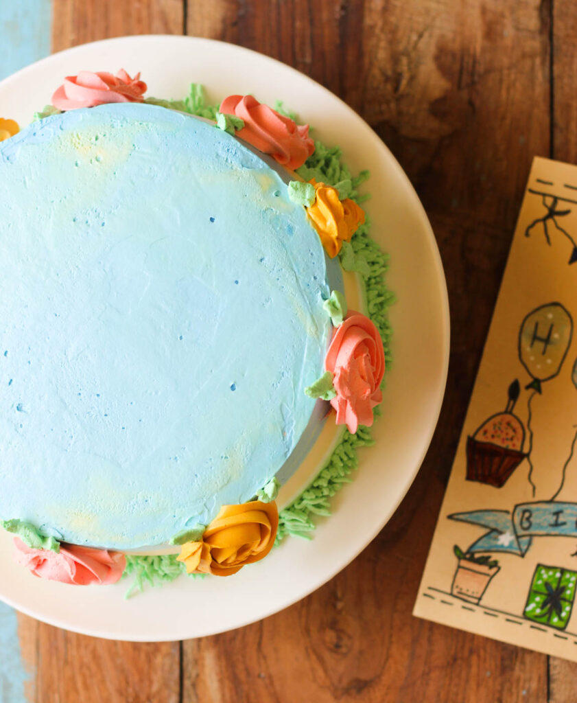 Perfectly golden baked eggless mango cake in a cake tin
