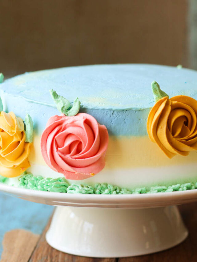 Homemade eggless mango spring cake cooling on a wire rack
