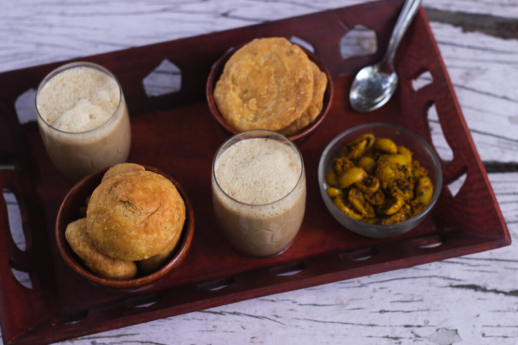 A plate with Karonde Ka Achar, served alongside Indian snacks