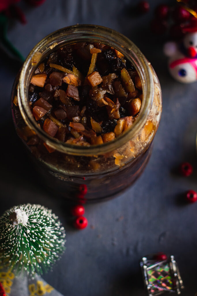 The process of soaking dried fruits in brandy for the Christmas fruit cake recipe