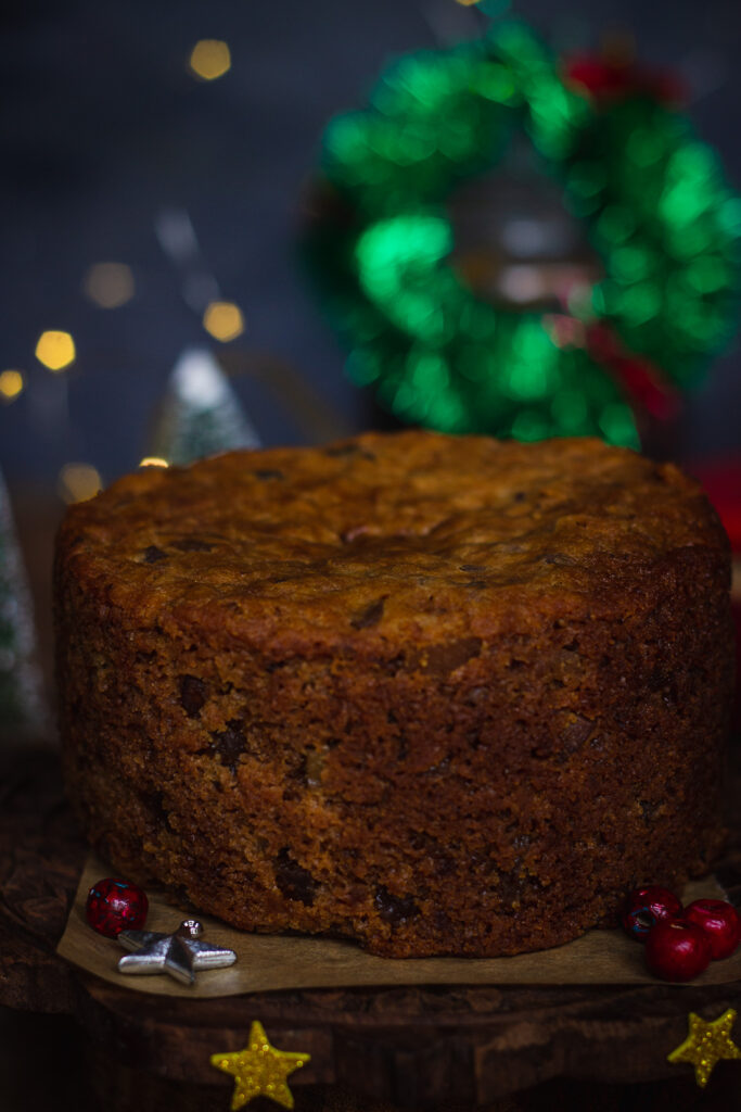 A rich and moist brandied Christmas fruit cake, topped with colorful candied fruits