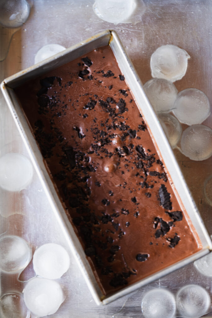 Close-up of smooth chocolate ice cream texture with visible chips