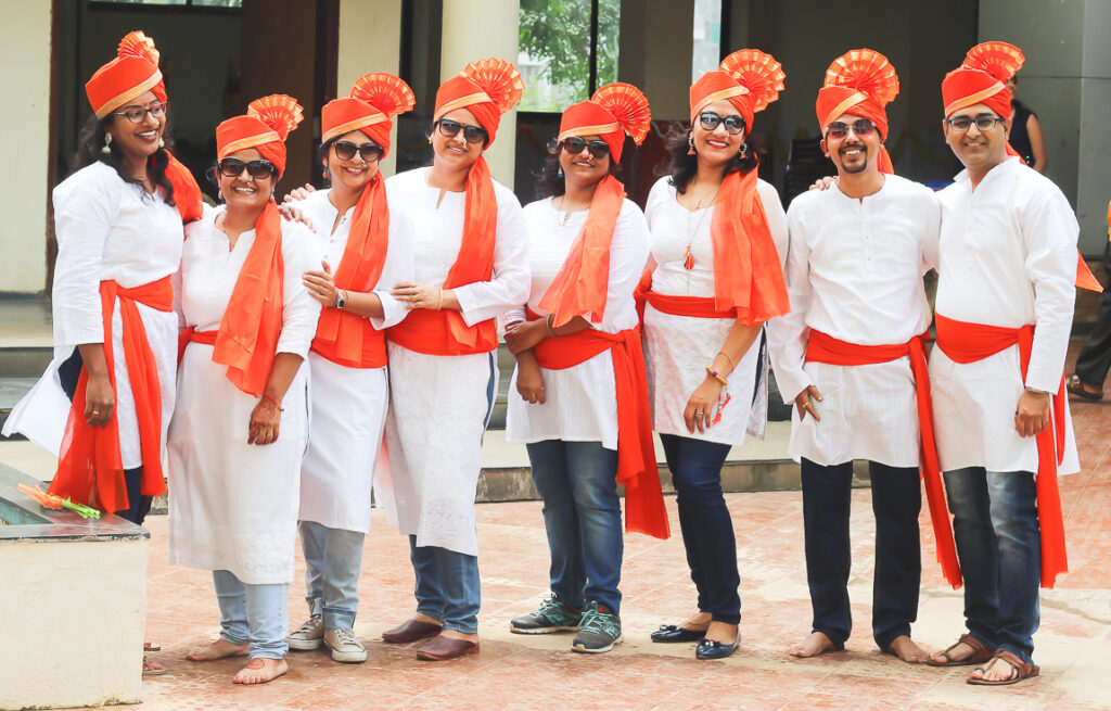 Family sharing stories and memories of past Ganesh Chaturthi festivals.